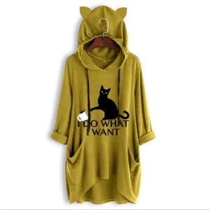 Cat ear hoodie detail view featuring black cat graphic and slogan print on yellow fabric.