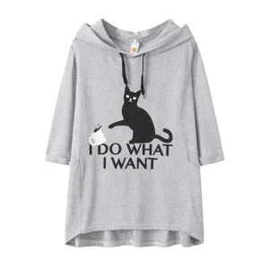 Grey loose knit hooded sweatshirt with cat graphic and slogan, casual short sleeve top.
