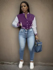 Detailed view of the women colorblock varsity jacket featuring snap buttons and stylish design.