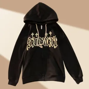 Black zip-up hoodie featuring stylish gothic lettering and cross motifs for casual streetwear look.