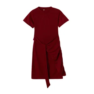 Burgundy dress detail showing the asymmetrical draped skirt, short sleeves, and waist tie design.