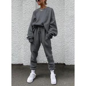 Womens solid color long sleeve crewneck sweatshirt and sweatpants casual tracksuit set.