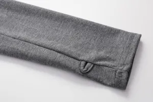 Grey hoodie sleeve cuff detail close-up showcasing neat stitching and thumb hole design.