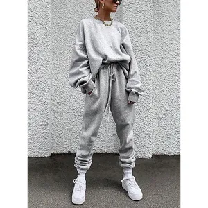 Detailed view of the casual solid grey long sleeve sweatshirt and sweatpants tracksuit set.