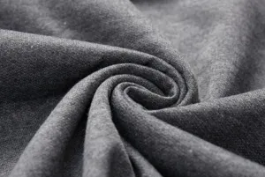 Grey fabric detail close-up showing soft texture and cozy knit material for apparel.