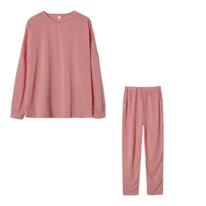 Women's solid color long sleeve top and pants casual loungewear pajama set in pink.