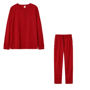 Details of the red long sleeve top and pants casual set, showing fabric texture and cuffs.