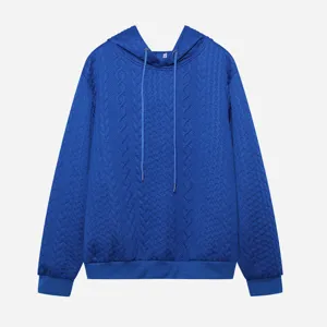 Close-up detail of the blue jacquard long sleeve hoodie with drawstring hood and knit texture.