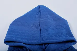 Blue jacquard hoodie hood detail shot showing textured knit fabric and comfortable fit.