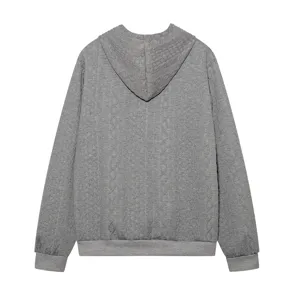 Detailed view of grey textured long sleeve hooded sweatshirt showing fine ribbed cuffs and hem.