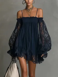 Detalle de vestido de encaje con hombros descubiertos y fina textura floral.