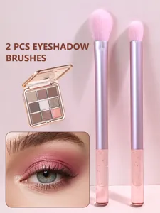 Detail view of 2 pcs crystal handle eyeshadow brushes and 9-color palette makeup set.