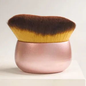 Soft wave makeup brush with pink ergonomic base, ideal for liquid foundation and body tanning application.