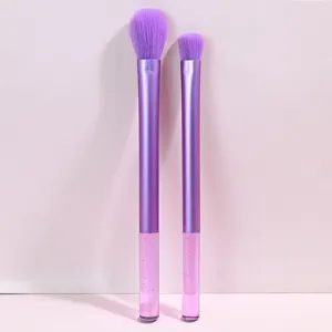 Detail view of purple makeup brush set with crystal glitter handles and soft bristles.