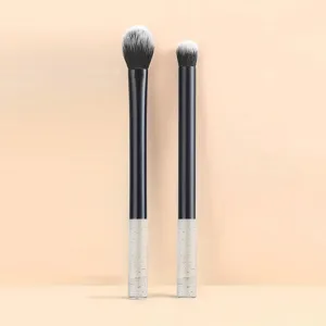 Detail view of a 2-piece makeup brush set with crystal handle, soft bristles for eye shadow.