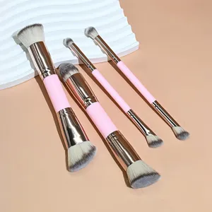 Vista detallada del juego de brochas de maquillaje rosas de doble punta con cerdas suaves.