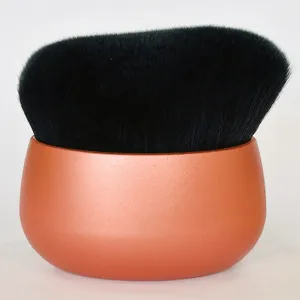 Professional oval makeup brush with dense soft bristles and ergonomic metallic rose gold handle.