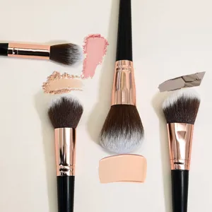 Professional makeup brush set detail view showing soft synthetic bristles and rose gold handles.