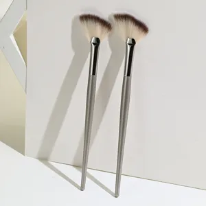 Professional dual-piece fan-shaped makeup brush set for facial highlighter and detailing.