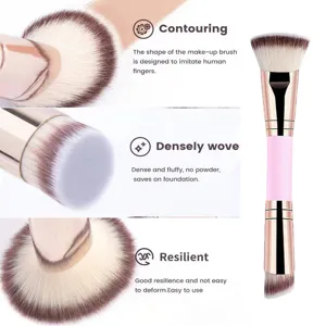 Dual-ended makeup brush detail showing soft dense bristles and ergonomic pink handle design.