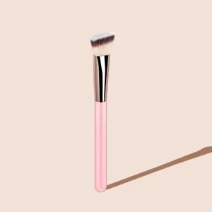 Detailed shot of angled makeup brush with soft synthetic bristles and pink handle for smooth.