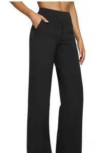 Close-up detail of women high waisted black wide leg knit trousers with front pockets.