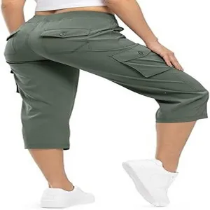 Detail view of women green cargo capris showing side pockets and casual outdoor fit.
