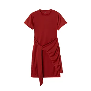Close-up detail of red short sleeve dress featuring stylish waist tie and elegant ruched hem.