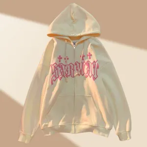 Casual zip-up hoodie with gothic pink letter print and cross details for cool streetwear.