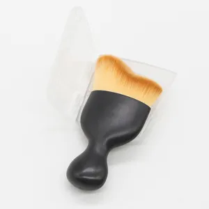 Detailed view of the ergonomic black contour makeup brush with clear plastic case.