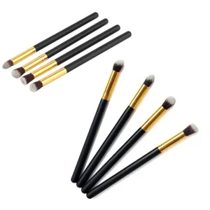Detail view of eye shadow makeup brush set, featuring soft dual-color bristles and golden ferrule.