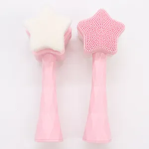 Brosse nettoyante visage double face en silicone avec poils doux et poignée en forme d'étoile.