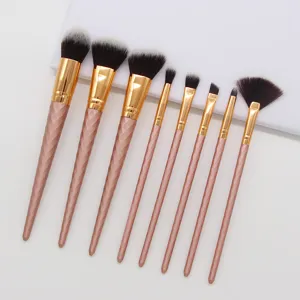Detailed view of 8-piece rose gold makeup brush set with textured handles and soft bristles.