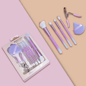 Detailed view of the 6-piece purple makeup brush set with foundation brushes and cosmetic tools.
