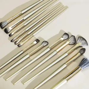 Detailed view of soft bristle eye makeup brushes set with golden handles for precise blending.