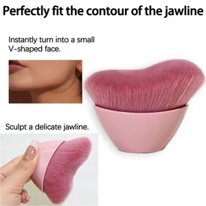 Wave makeup brush detail view showing soft pink bristles and comfortable ergonomic handle.
