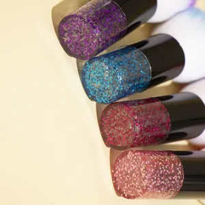 Detailed close-up of makeup brushes featuring beautiful glitter handles in multiple colors.