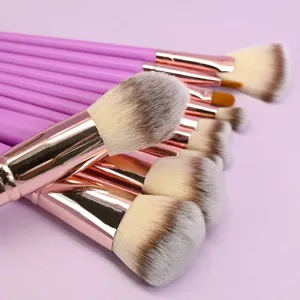 Detailed close-up view of makeup brush set featuring purple handles and soft gradient bristles.