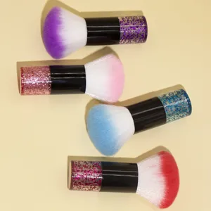 Close-up of soft bristle makeup dust brushes featuring sparkling glitter handles.