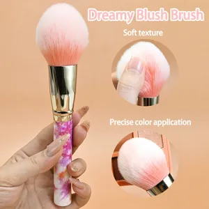 Soft marble handle blush brush with fluffy gradient bristles for precise makeup application.