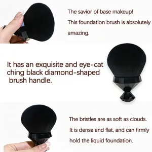 Soft dense foundation brush with black diamond handle showing smooth makeup application detail.