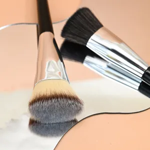 Close-up detail shot of professional flat top makeup foundation brush with soft dense bristles.