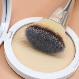 Flat top makeup brush and pressed powder compact set, soft bristles for smooth face.