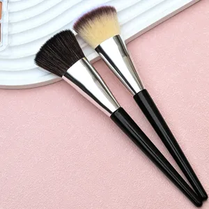 Detailed close-up shot of professional makeup brushes featuring soft bristles and sleek handles.
