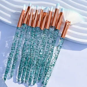 10-piece crystal makeup brush set with green glitter handles and rose gold ferrules for eyes.