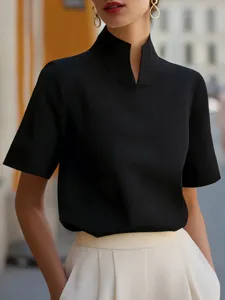 Detail shot of a black short sleeve stand collar shirt featuring unique Chinese style design.