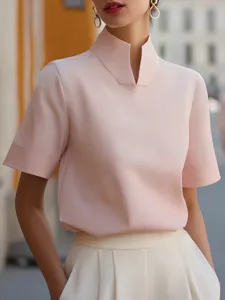 Detail view of the pink Chinese-style stand collar short sleeve shirt, elegant commuting top.