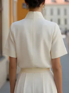 Detail view of a white neo-Chinese stand collar short sleeve shirt, elegant commuter fashion.