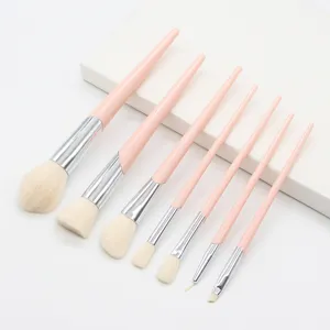 Detailed view of 7-piece pink makeup brush set with soft bristles and sleek handles.