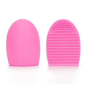 Detailed view of the pink silicone makeup brush cleaner egg showing textured cleaning ribs.